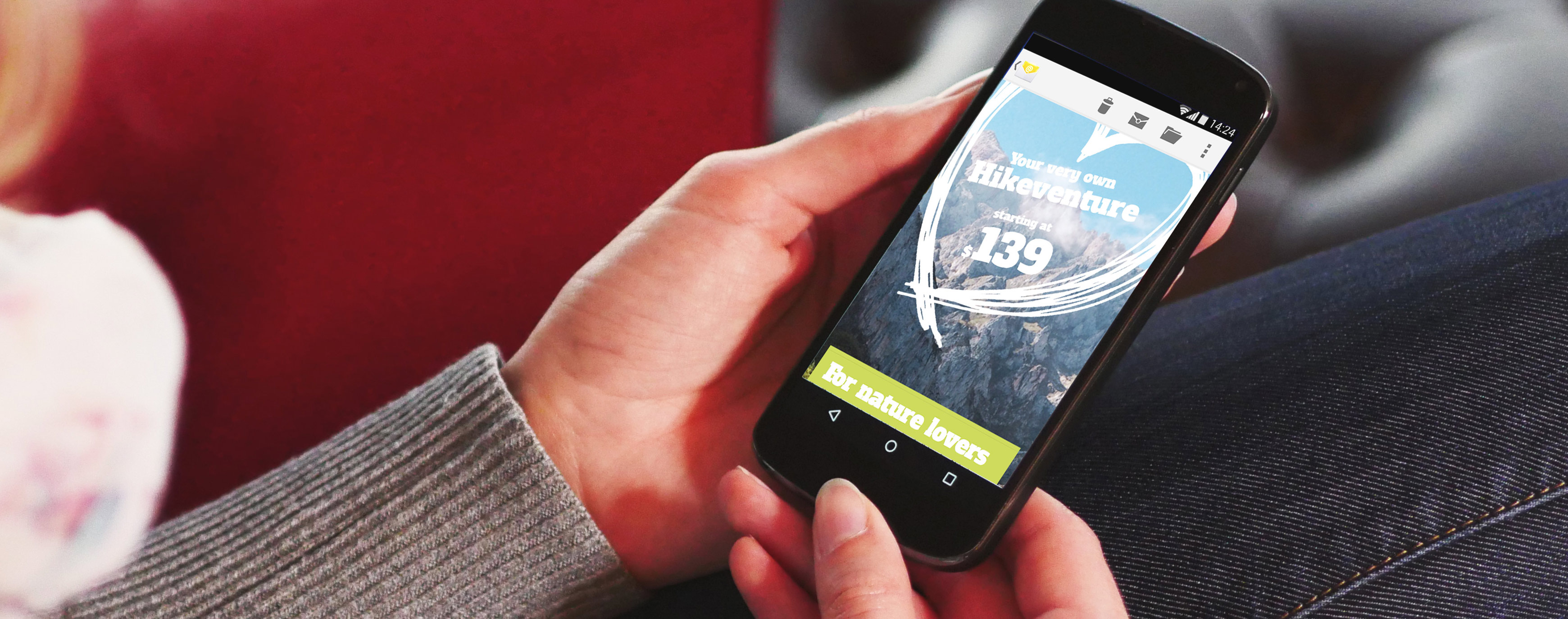 A person holding an Android smartphone displaying an email from "Hikeventure" that promotes "your next own Hikeventure starting at $139 for nature lovers." This image highlights the mobile-friendliness of email designs created with Mail Designer 365.