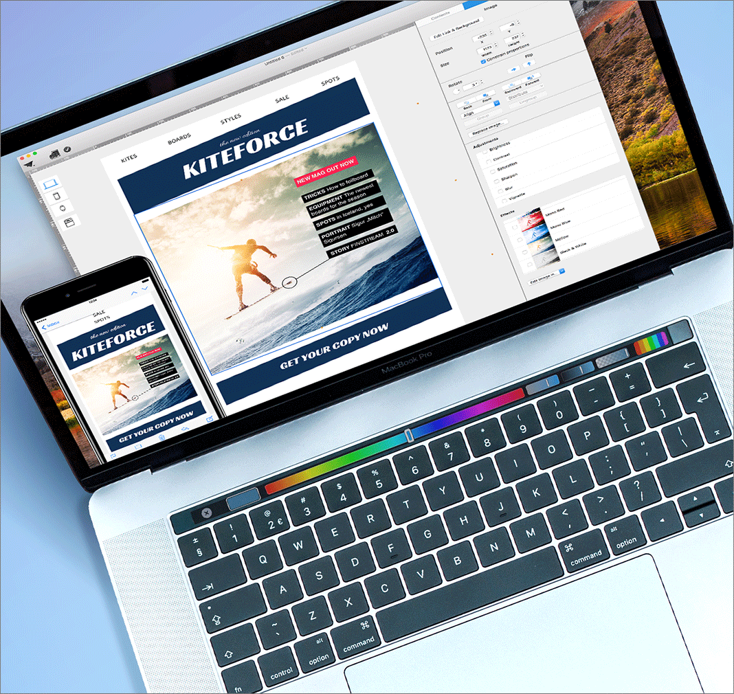 An email design being created on a MacBook Pro with the Mail Designer 365 software, showing a "KITEFORCE" newsletter with a kitesurfing image and a "GET YOUR COPY NOW" button. A smartphone is placed in front of the laptop, displaying the mobile preview of the same email, highlighting the software's responsive design capabilities.